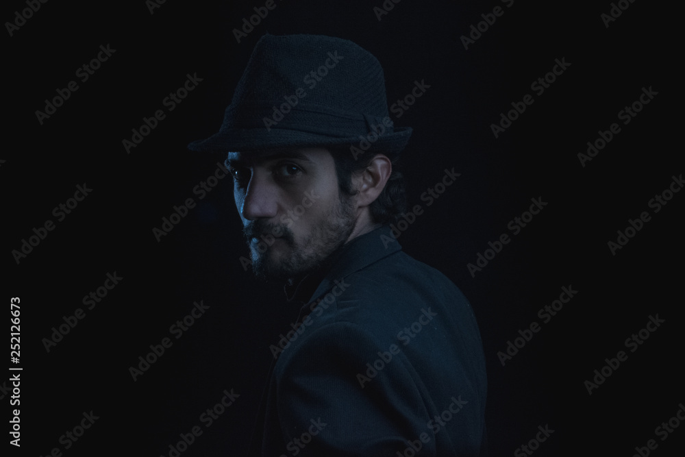 dark portrait of a young man with hat dark portrait of a young man with hat