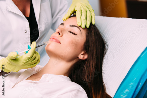 Beautiful young woman gets beauty injection