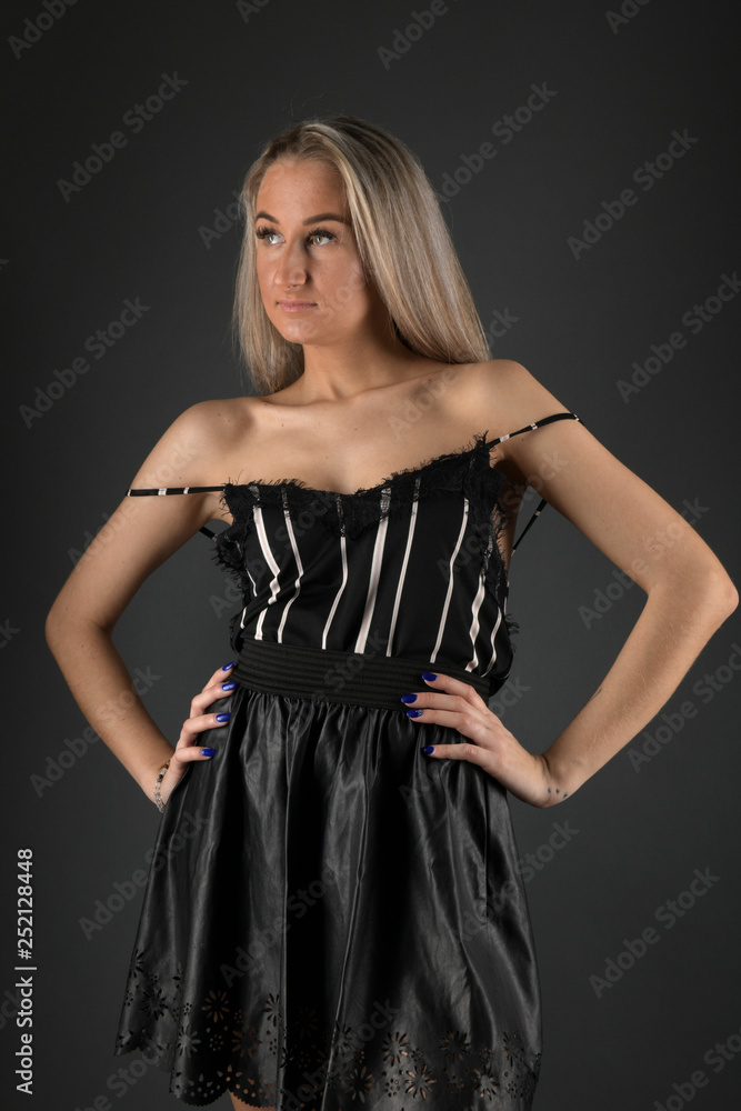 Fototapeta premium beautiful woman with long blond hair on black background 