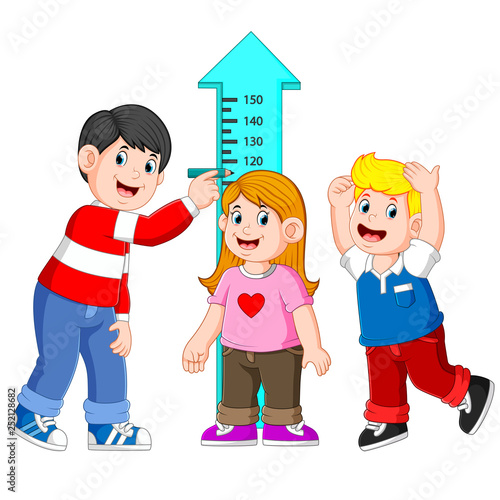 Father measuring his child height with height measurement