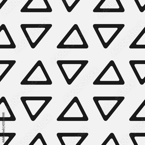 Seamless pattern with triangles. Simple geometric print.