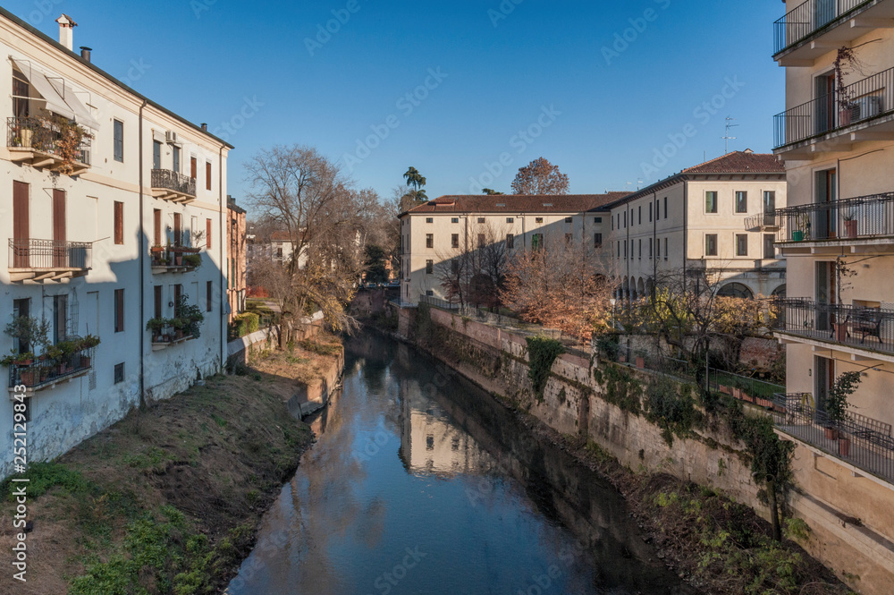 VICENZA, ITALY - DECEMBER 29, 2018: View from Ponte San Michele, ancient stone bridge in the historic city center - Vicenza, Italy 