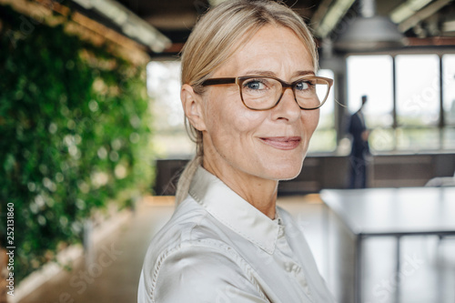 Portrait of confident businesswoman in office photo