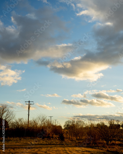 sunset over power poles