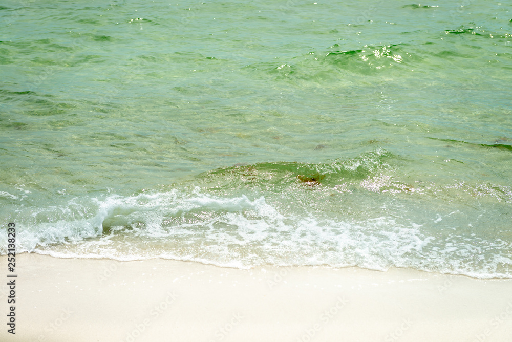 The surface of the beach water ripples The surface of the beach water ripples