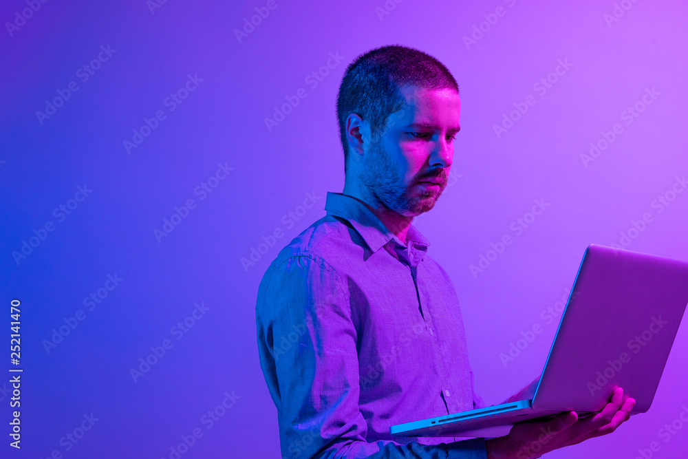 Businessman working on a handheld laptop pc Businessman working on a handheld laptop pc