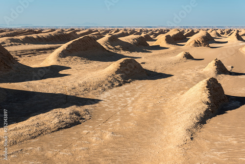 View of egg  mountains, yardangs in Kaluts desert, part of Dasht-e Lut desert in province Kerman, Iran photo