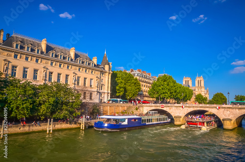 Bridge Pont au Change and buildings near the Seine river in Paris, France photo