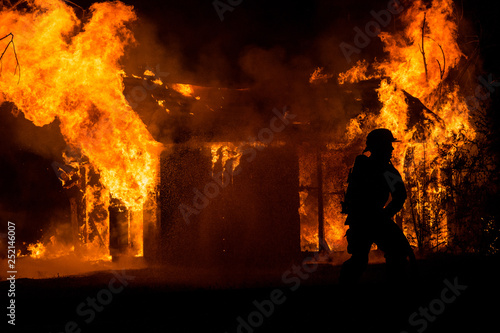 Firefighter Battles Blaze from Shed Fire