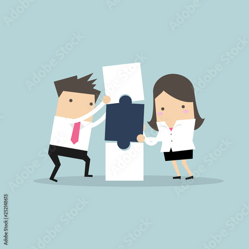 Businessman and businesswoman with puzzle box. Business and partnership concept.