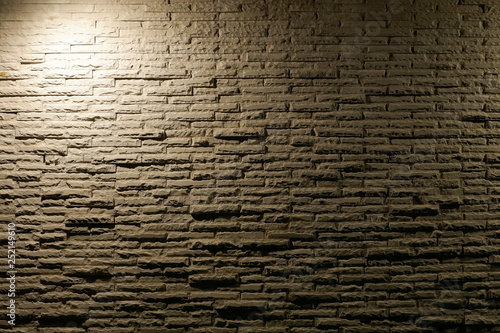 white light with shadow on grunge brick wall