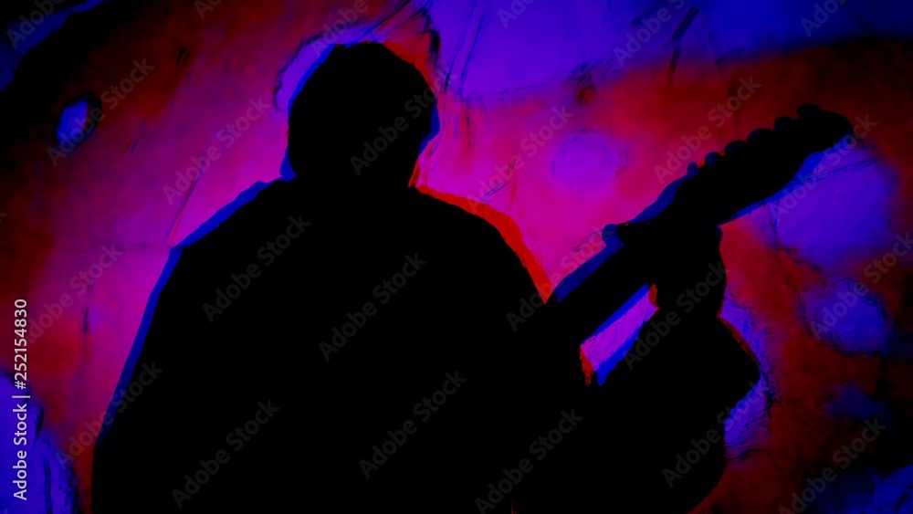 Man's silhouette playing guitar with psychedelic colors swirling about. Man's silhouette playing guitar with psychedelic colors swirling about.