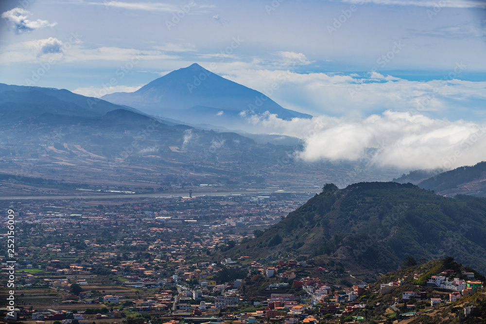 Stunning view of the volcano Teide and the city of San Cristóbal de La Laguna from the viewpoint Mirador De Jardina, which is located on the road number 12. Tenerife. Canary Islands..Spain