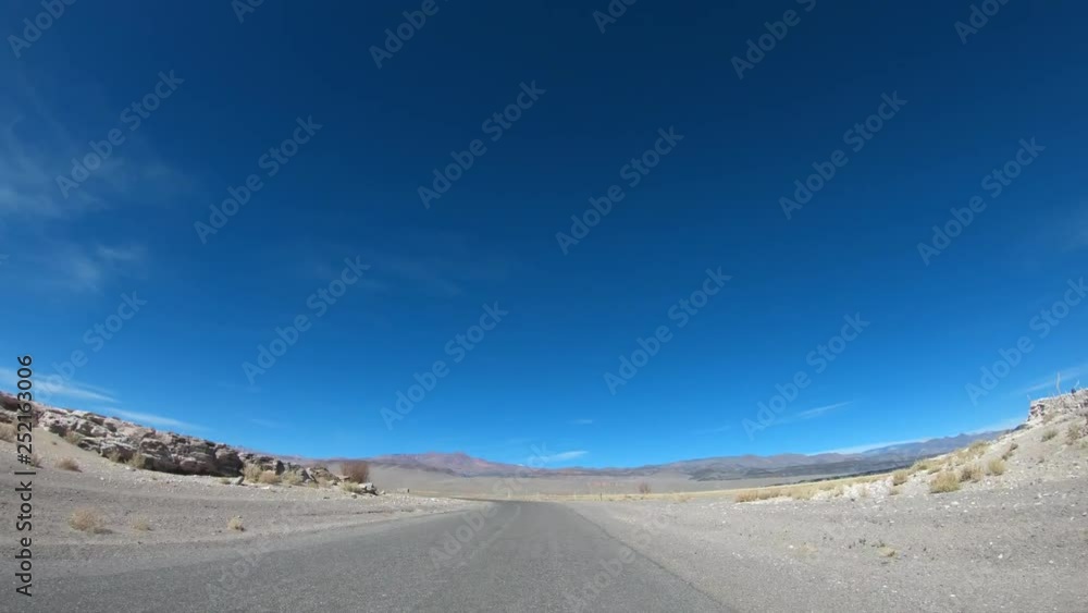 Time lapse driving along road in desert volcanic area and entering old town. Passing by bed of lava, black, red volcanos and Antofagasta lagoon. Antofagasta de la Sierra, Catamarca, Argentina Time lapse driving along road in desert volcanic area and entering old town. Passing by bed of lava, black, red volcanos and Antofagasta lagoon. Antofagasta de la Sierra, Catamarca, Argentina