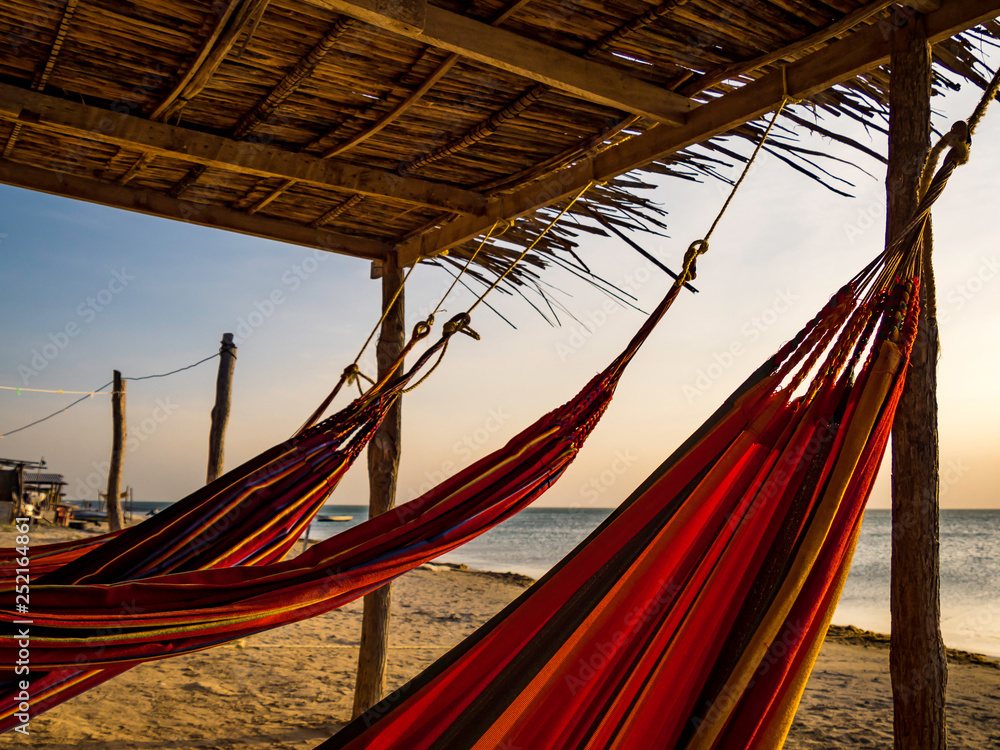 Colorful hammocks in front of the beach in Cabo de la Vela, Colombia