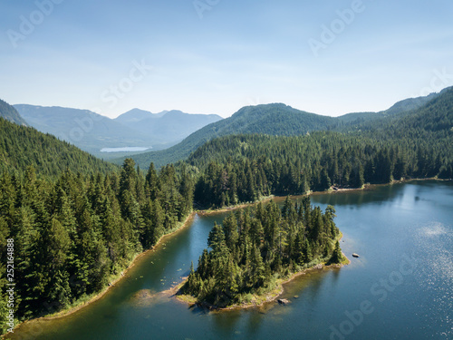 Aerial view of a beautiful Canadian Landscape during a sunny summer day. Taken in Kenyon Lake, located near Mission, East of Vancouver, BC, Canada. photo