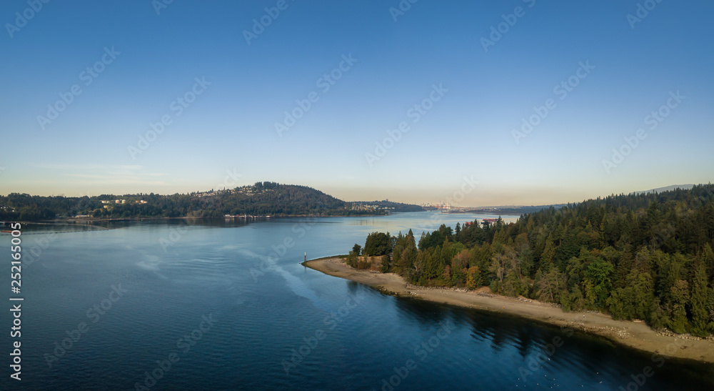 Aerial Panoramic view of a beautiful Ocean Inlet in the Modern City during a sunny summer day. Taken in Deep Cove, North Vancouver, BC, Canada. Aerial Panoramic view of a beautiful Ocean Inlet in the Modern City during a sunny summer day. Taken in Deep Cove, North Vancouver, BC, Canada.