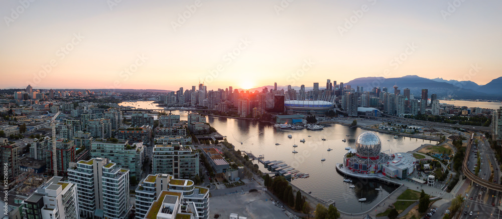 Aerial Panoramic view of a modern city during a sunny summer sunset. Taken in Downtown Vancouver, British Columbia, Canada.
