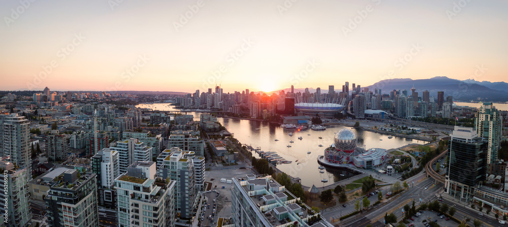 Obraz premium Aerial Panoramic view of a modern city during a sunny summer sunset. Taken in Downtown Vancouver, British Columbia, Canada.