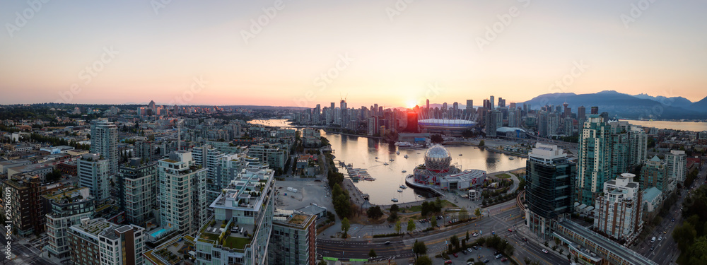 Aerial Panoramic view of a modern city during a sunny summer sunset. Taken in Downtown Vancouver, British Columbia, Canada.