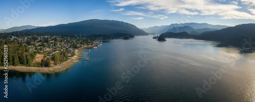 Aerial Panoramic view of a beautiful Ocean Inlet in the Modern City during a sunny summer day. Taken in Deep Cove, North Vancouver, BC, Canada.
