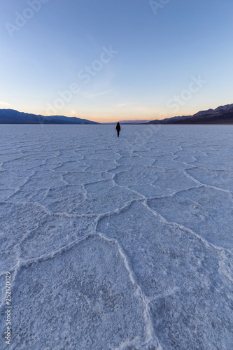 Woman walking on Salt Pan at the Badwater Basin  Death Valley National Park  California  United States.