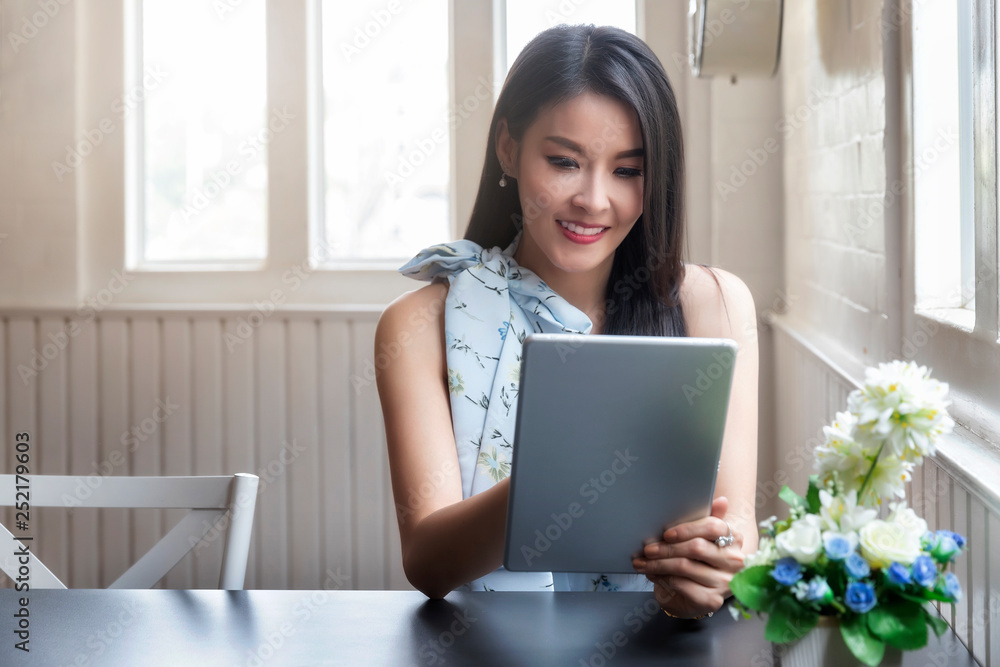 businesswoman working with tablet computer at office desk. businesswoman working with tablet computer at office desk.