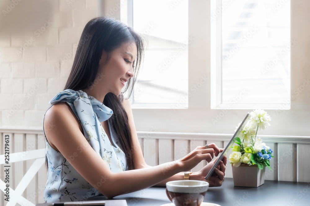 businesswoman working with tablet computer at office desk. businesswoman working with tablet computer at office desk.
