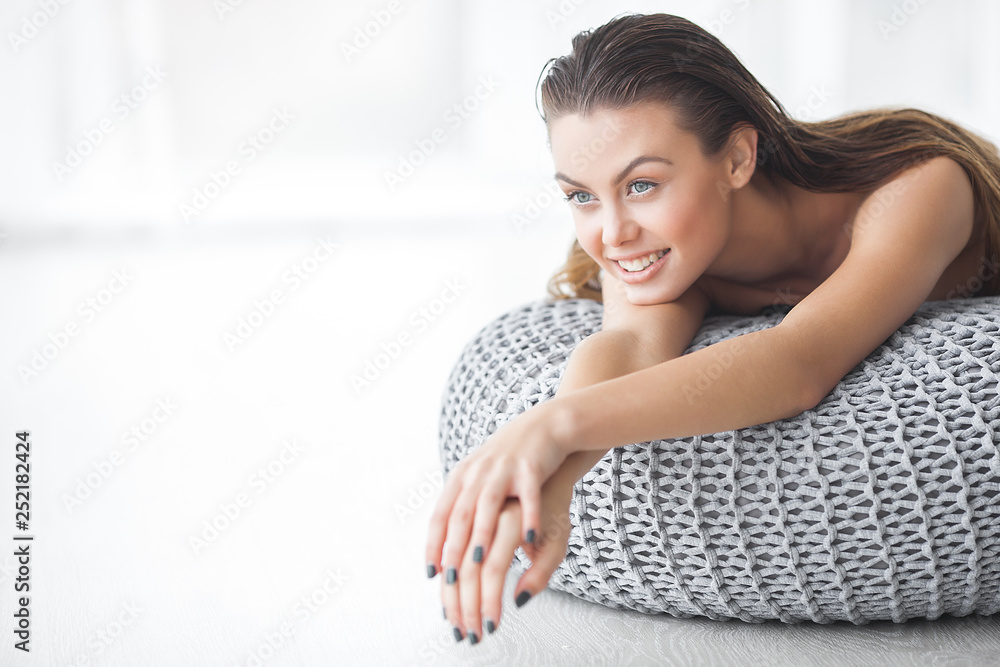 Beautiful woman spa. Charming beauty indoors. Luxury lady relaxing. Blond female on neutral background.