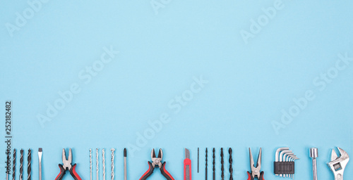 Set of different tools on blue background photo