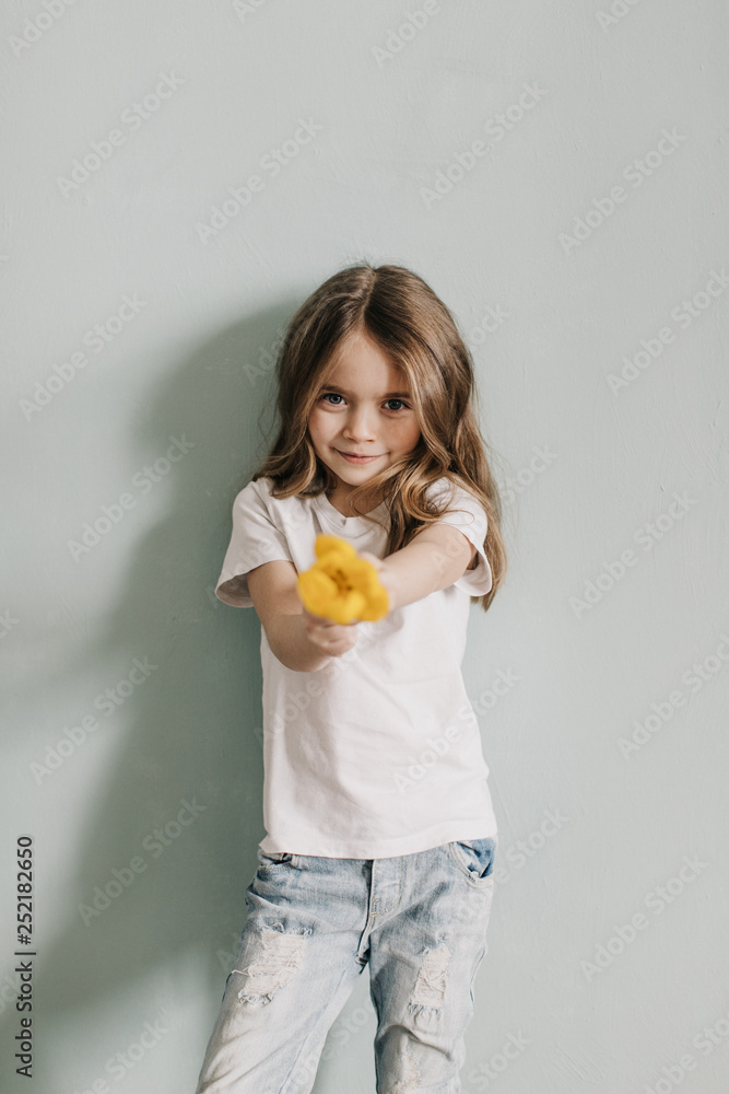 little beautiful girl with yellow tulip little beautiful girl with yellow tulip