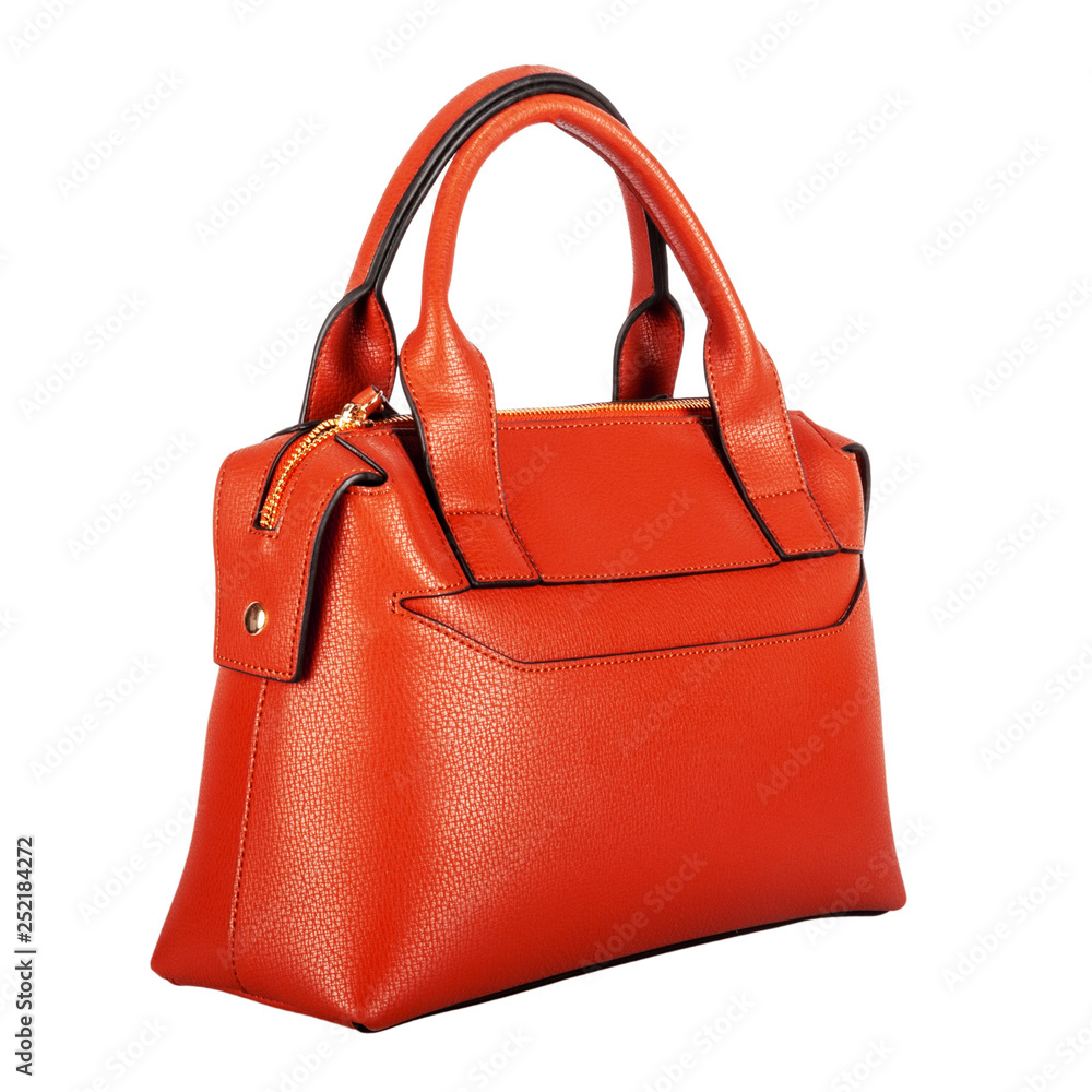 Fashionable orange classic women's bag with gold fittings and leather texture on the front on a white background Fashionable orange classic women's bag with gold fittings and leather texture on the front on a white background