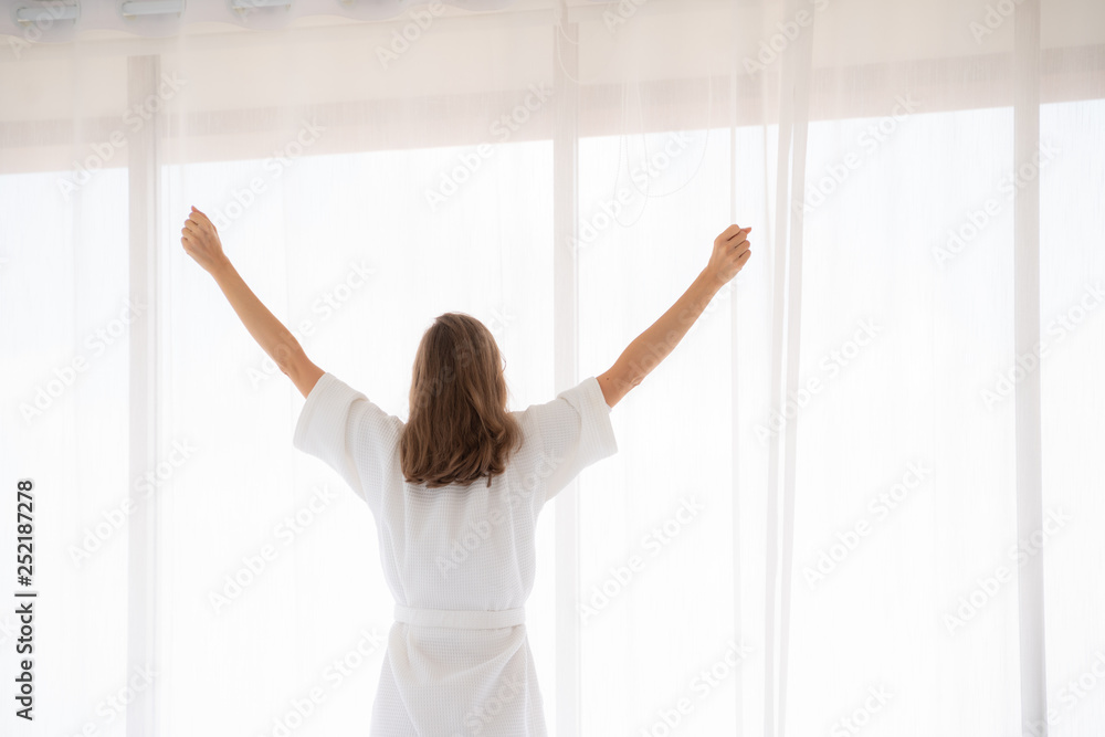 pregnancy, motherhood, people and expectation concept - close up of happy pregnant woman opening window curtains. pregnancy, motherhood, people and expectation concept - close up of happy pregnant woman opening window curtains.