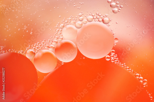Coral colored abstract background with bubbles
