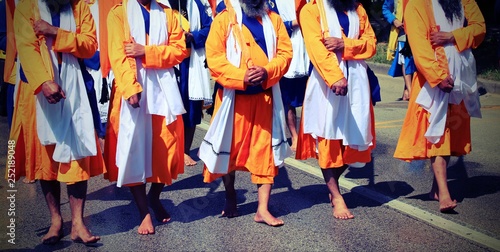 Men of Sikh Religion on the street with swords during a parade