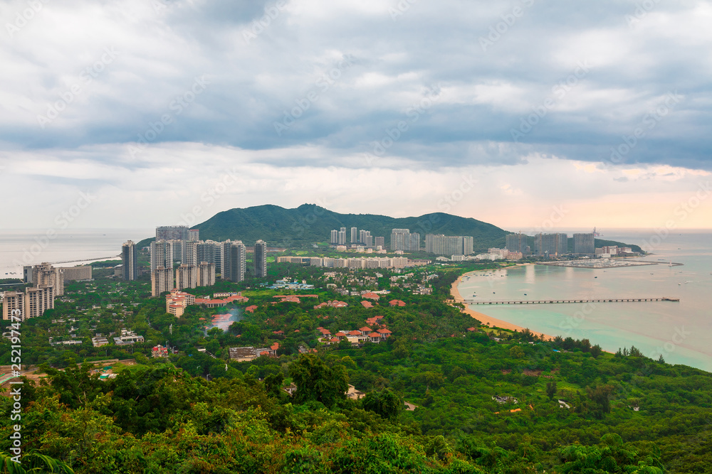 Beautiful Panoramic view of the resort city, China, Hainan. Town Sanya is popular tourist destination in China. Residential area of city Sanya, ashore South China Sea Beautiful Panoramic view of the resort city, China, Hainan. Town Sanya is popular tourist destination in China. Residential area of city Sanya, ashore South China Sea