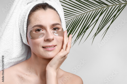 Woman with under-eye patche...