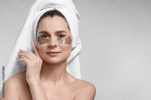 Woman with under-eye patche...