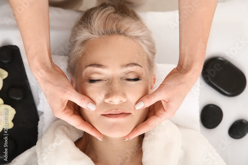 Mature woman receiving face...