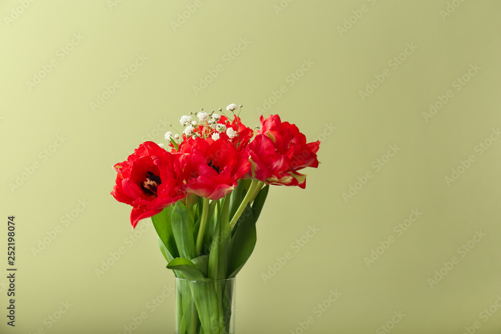 Obraz premium Bouquet of beautiful tulips on color background