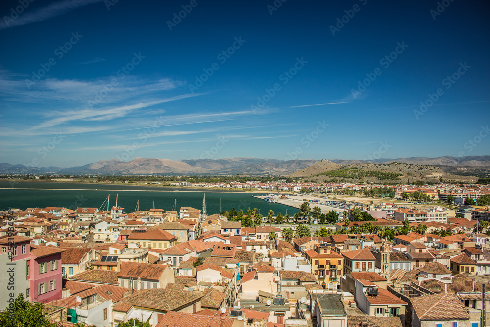 aerial city photography of old medieval town with small port sea bay