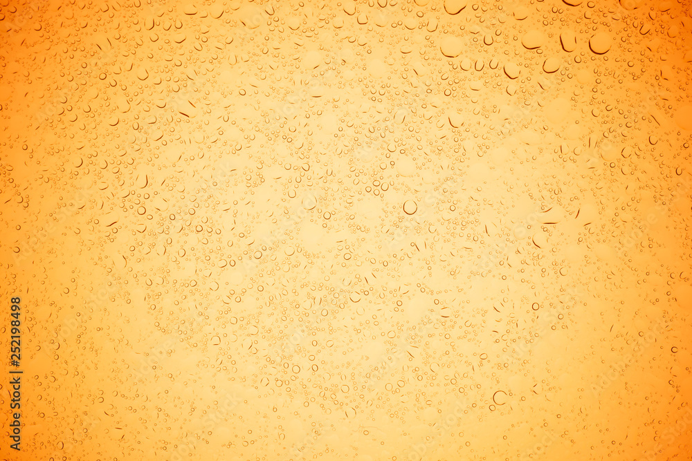 Rain droplets on yellow glass background, Water drops on yellow glass. Rain droplets on yellow glass background, Water drops on yellow glass.