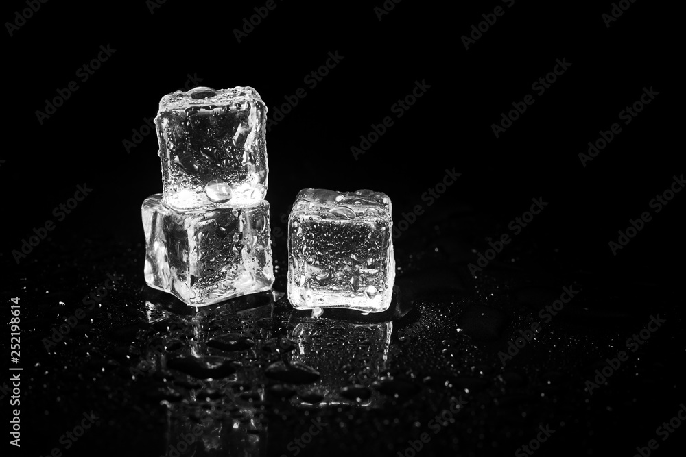 ice cubes reflection on black table background. ice cubes reflection on black table background.