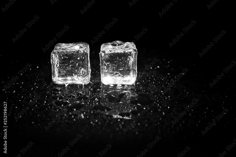 ice cubes reflection on black table background. ice cubes reflection on black table background.
