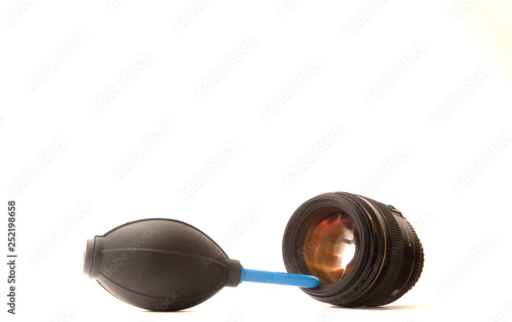 Technician engineer or photographer cleaning camera lens with air blower,  vacuum air pump. Hand blower dust from lens on white workspace.Repair,  maintenance Concept Stock Photo | Adobe Stock