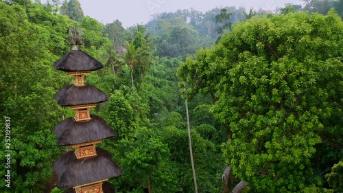 Buddhist Pura Gunung Lebah temple in Ubud tropical forest. Aerial drone 4k footage. photo