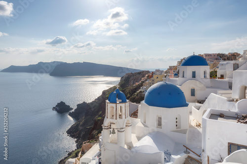 Sunset over blue domed churches on the Caldera at Oia on the Greek Island of Santorini.