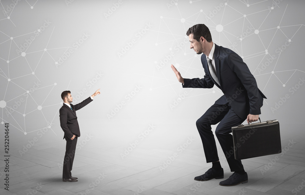 Small businessman aiming at a big businessman with connection and network concept
Small businessman aiming at a big businessman with connection and network concept