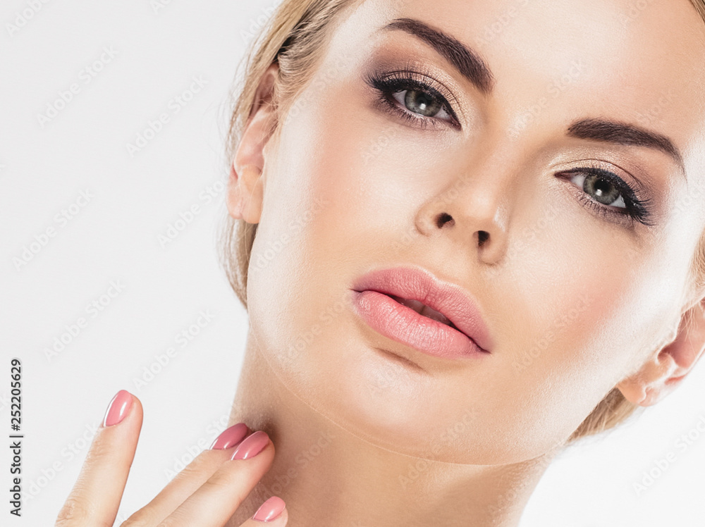 Beautiful woman blonde hair face close up portrait studio on white Beautiful woman blonde hair face close up portrait studio on white