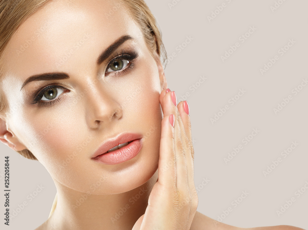 Beautiful woman blonde hair face close up portrait studio on white Beautiful woman blonde hair face close up portrait studio on white